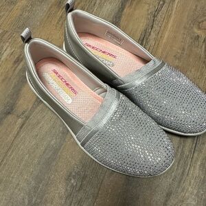 Skechers slip on silver sparkly shoes size 6.5. Brand new.